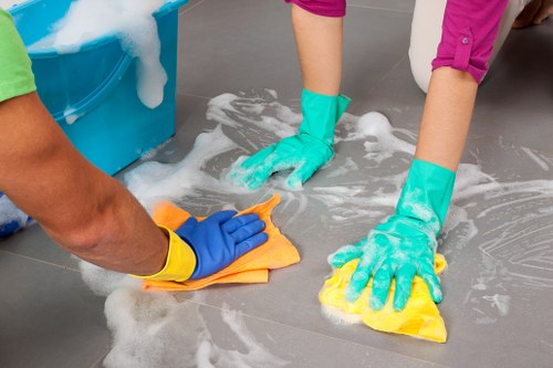 Professional carpet cleaner using equipment with attention to hazard control