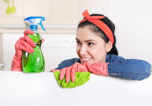 Technician using protective equipment during carpet cleaning